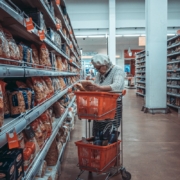woman-standing-near-shopping-cart-stockpack-unsplash.jpg woman standing near shopping cart