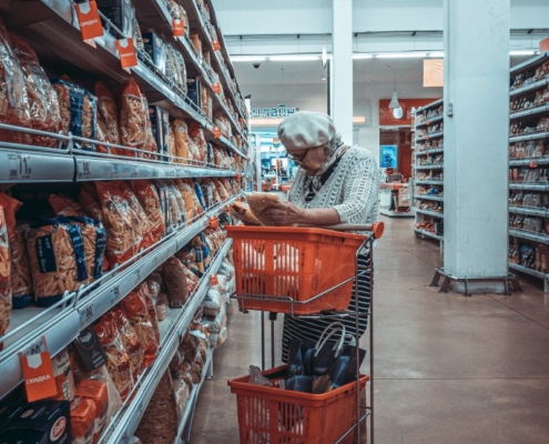 woman-standing-near-shopping-cart-stockpack-unsplash.jpg woman standing near shopping cart