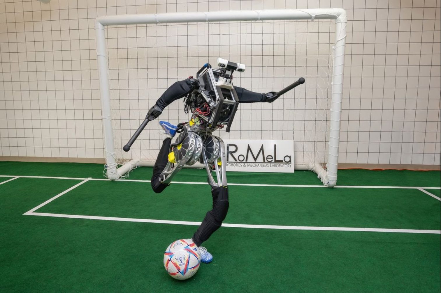 Artemis+humanoid+robot+kicking+a+soccer+ball+romela+at+ucla Hero