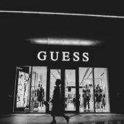 a black and white photo of a guess store