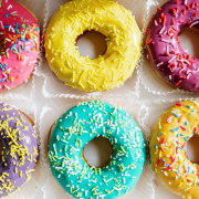 Pink doughnut on white textile