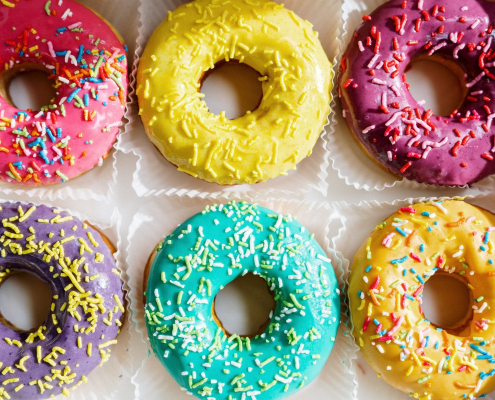 pink-doughnut-on-white-textile-stockpack-pexels.jpg Pink doughnut on white textile