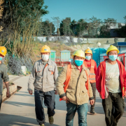 a-group-of-people-walking-down-a-sidewalk-wearing-face-masks-stockpack-unsplash.jpg a group of people walking down a sidewalk wearing face masks
