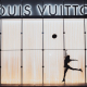 a-woman-jumping-beside-glass-wall-with-louis-vuitton-signage-stockpack-pexels.jpg A woman jumping beside glass wall with louis vuitton signage