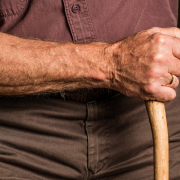 man-holding-wood-cane-stockpack-pexels.jpg Man holding wood cane
