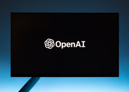 Monitor screen with openai logo on black background