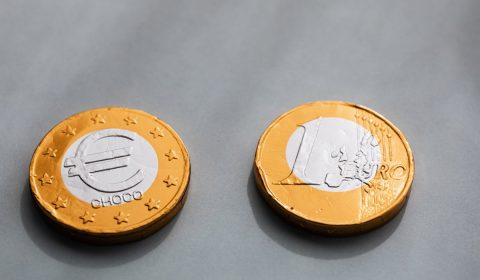 Coins one euros lying on gray table