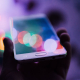 person-holding-smartphone-stockpack-unsplash.jpg person holding smartphone