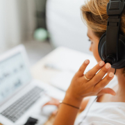 person-in-white-shirt-holding-black-headphones-stockpack-pexels.jpg Person in white shirt holding black headphones