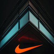 the-nike-logo-is-lit-up-on-the-side-of-a-building-stockpack-unsplash.jpg the nike logo is lit up on the side of a building