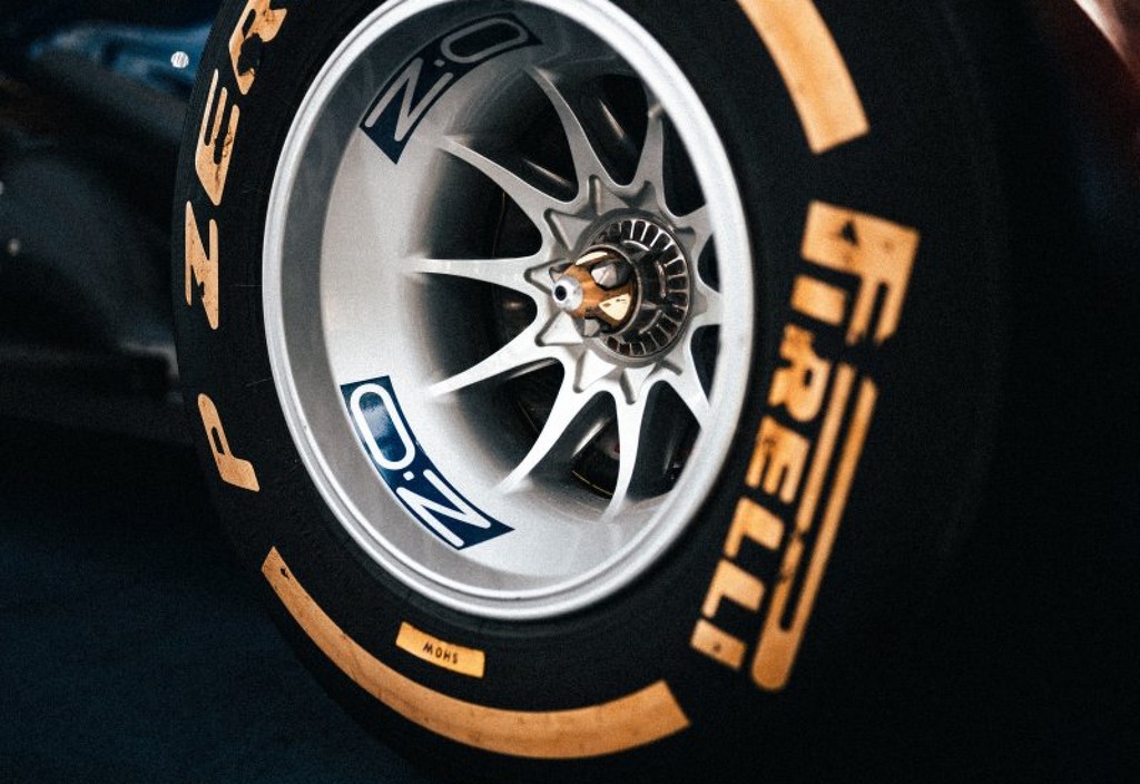 a-close-up-of-a-tire-on-a-race-car-stockpack-unsplash.jpg a close up of a tire on a race car