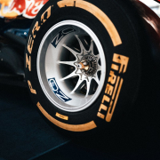a-close-up-of-a-tire-on-a-race-car-stockpack-unsplash.jpg a close up of a tire on a race car
