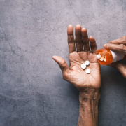 senior-hand-holding-pills-with-copy-space-stockpack-unsplash.jpg senior hand holding pills with copy space ,