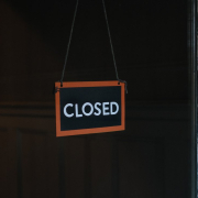 Closed sign hanging on a window