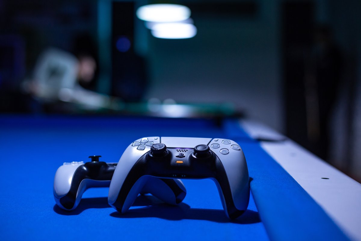 a-close-up-of-a-video-game-controller-stockpack-unsplash.jpg a close up of a video game controller