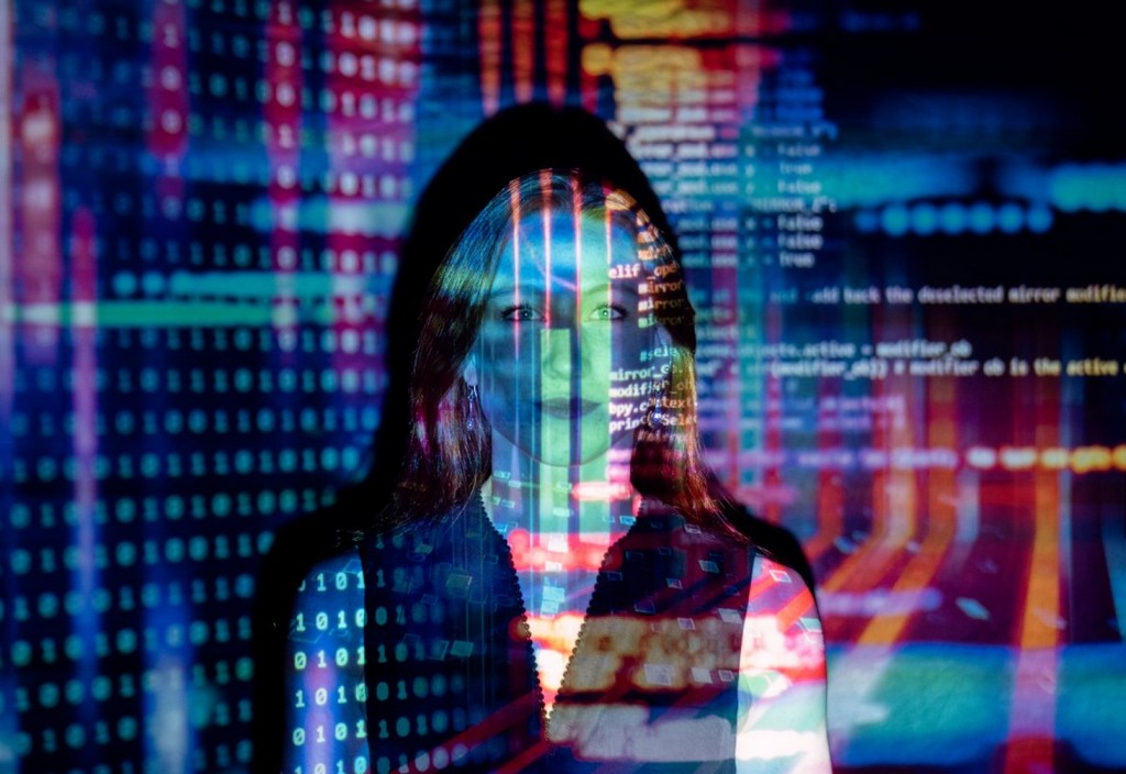 Code projected over woman