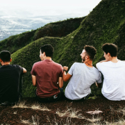 men-laughing-by-green-valley-stockpack-unsplash.jpg Men laughing by green valley