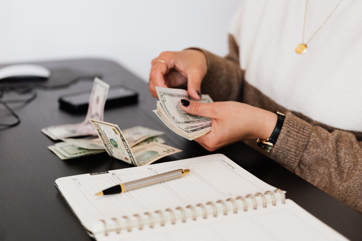 person-counting-cash-money-stockpack-pexels.jpg Person counting cash money
