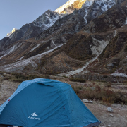 Sun rays hitting a snow-capped peak in the Himalayas.
