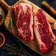 top-view-raw-meat-marbled-beef-top-blade-steak-on-wooden-cutting-board-with-cook-utensils-and-seasoning-stockpack-unsplash.jpg Top view raw meat marbled beef. Top blade steak on wooden cutting board with cook utensils and seasoning