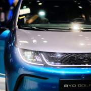 a-close-up-of-the-front-of-a-blue-and-white-car-stockpack-unsplash.jpg a close up of the front of a blue and white car