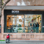 a-red-scooter-parked-in-front-of-a-store-stockpack-unsplash.jpg a red scooter parked in front of a store