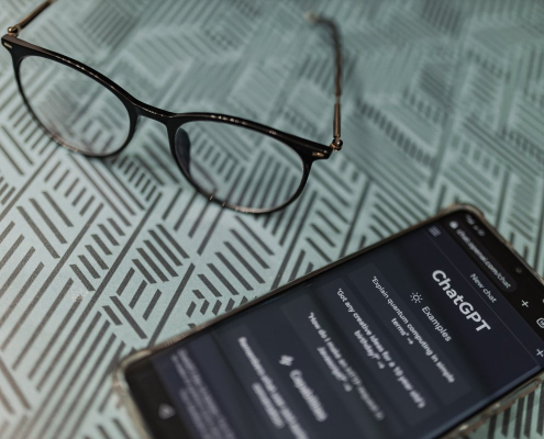 a-smart-phone-with-glasses-on-it-next-to-a-book-stockpack-pexels.jpg A smart phone with glasses on it next to a book