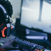 person-with-headphones-playing-video-game-stockpack-unsplash.jpg Person with headphones playing video game
