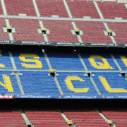 a blue and yellow sign that says ess guu un club