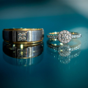 silver diamond ring on blue surface
