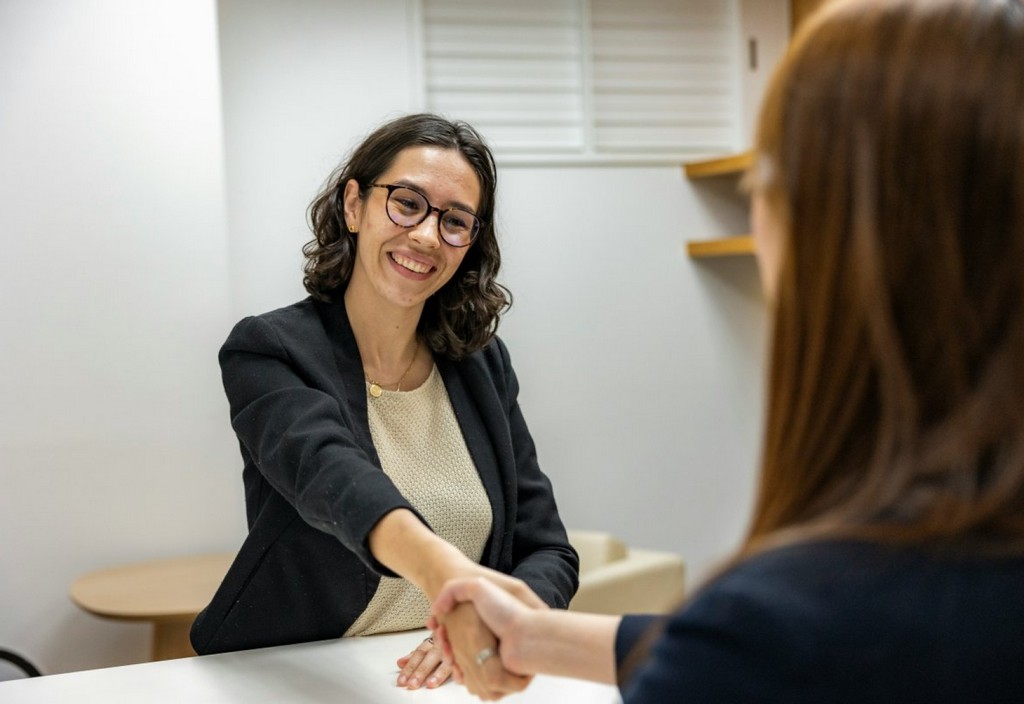 young-woman-in-business-attire-shaking-hands-with-recruiting-manager-after-job-interview-stockpack-unsplash.jpg Young Woman in Business Attire Shaking Hands With Recruiting Manager After Job Interview