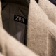 a-close-up-of-a-jacket-with-a-name-tag-on-it-stockpack-unsplash.jpg a close up of a jacket with a name tag on it