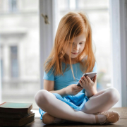 calm-small-ginger-girl-sitting-on-table-and-using-smartphone-in-light-living-room-stockpack-pexels.jpg Calm small ginger girl sitting on table and using smartphone in light living room