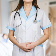 Detail of stethoscope. Doctor woman with white coat and stethoscope.