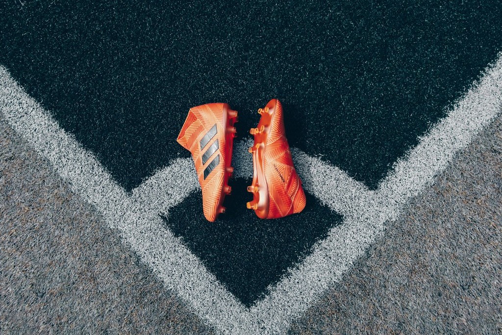 pair-of-orange-adidas-cleats-on-gray-surface-stockpack-unsplash.jpg pair of orange adidas cleats on gray surface