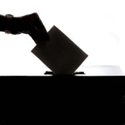 person-dropping-paper-on-box-stockpack-pexels.jpg Person dropping paper on box
