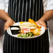 a-chef-holding-a-plate-with-a-sandwich-and-chips-stockpack-unsplash.jpg a chef holding a plate with a sandwich and chips
