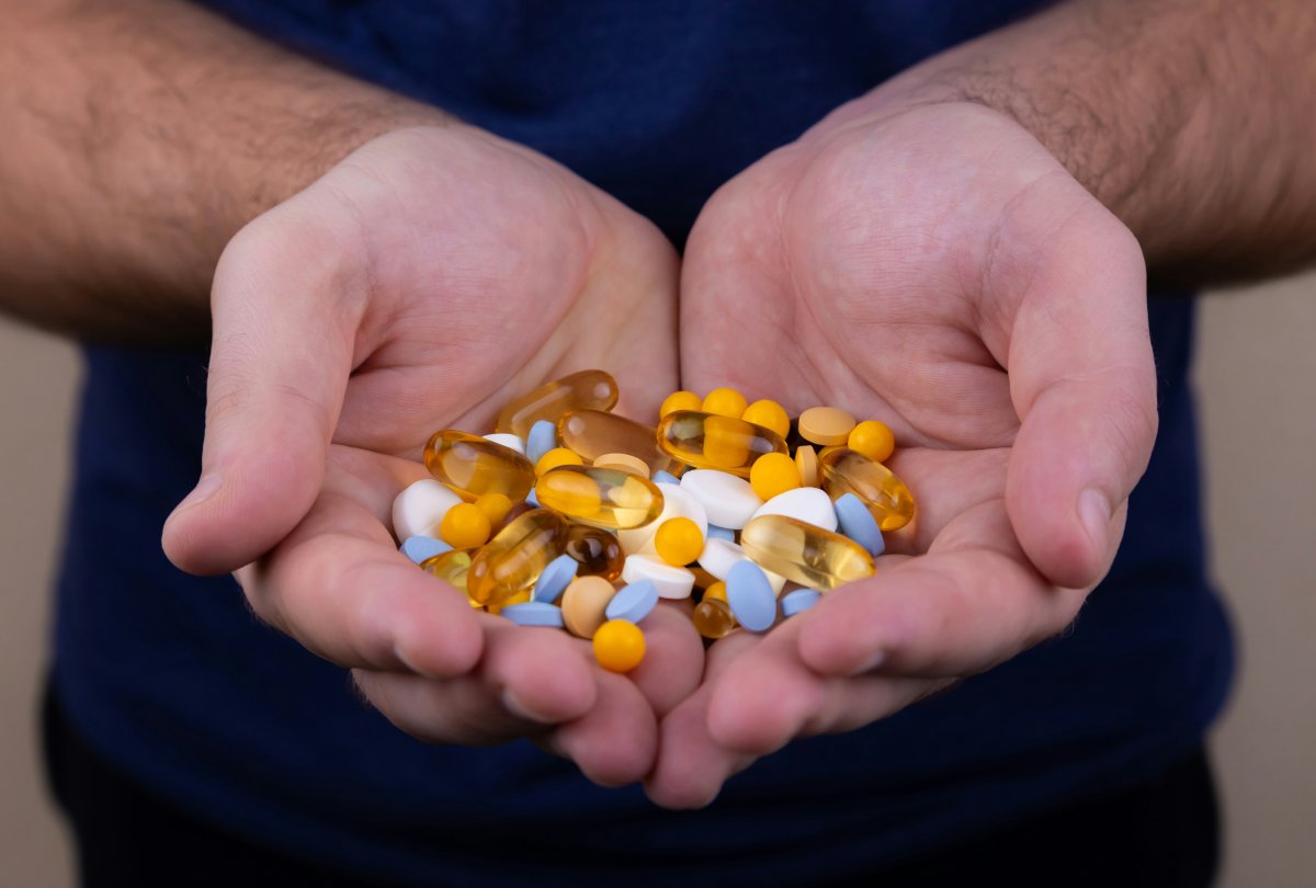 a-pile-of-multi-colored-pills-in-a-male-hand-a-man-holds-pills-in-his-hand-the-concept-of-medicine-illness-health-stockpack-unsplash.jpg A pile of multi-colored pills in a male hand. A man holds pills in his hand. The concept of medicine, illness, health