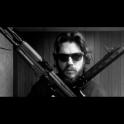 model-holding-two-guns-stockpack-unsplash.jpg Model holding two guns