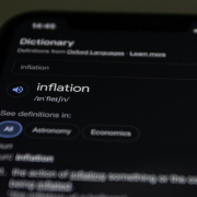 a close up of a cell phone with information on the screen