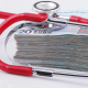 a-stethoscope-resting-on-top-of-a-stack-of-money-stockpack-unsplash.jpg a stethoscope resting on top of a stack of money