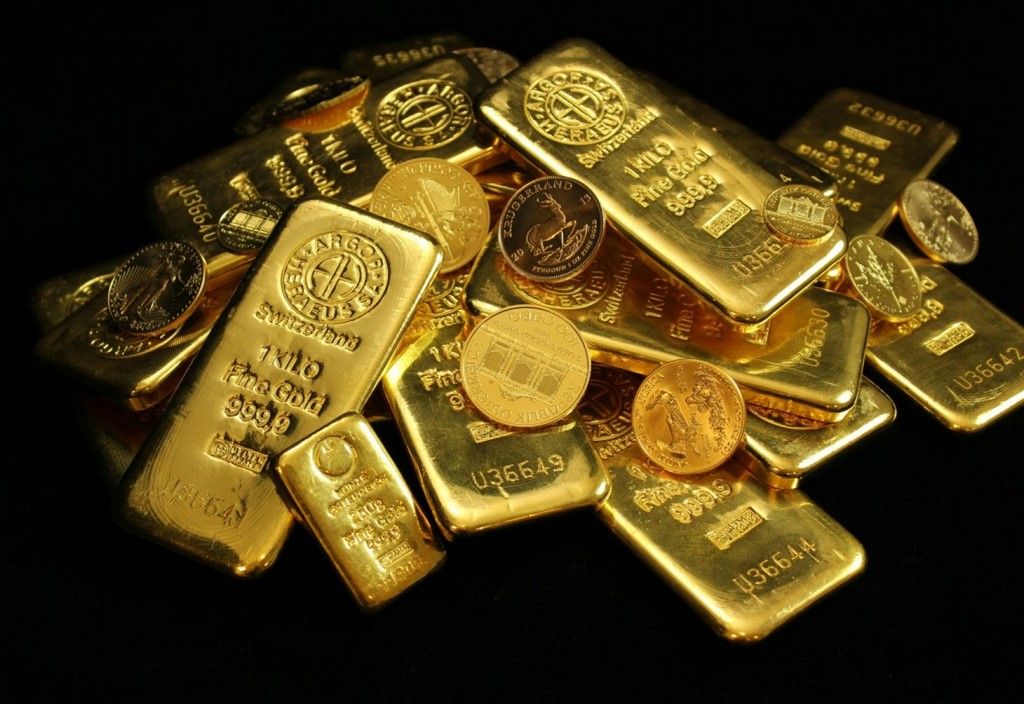 Gold coins and bars on black background