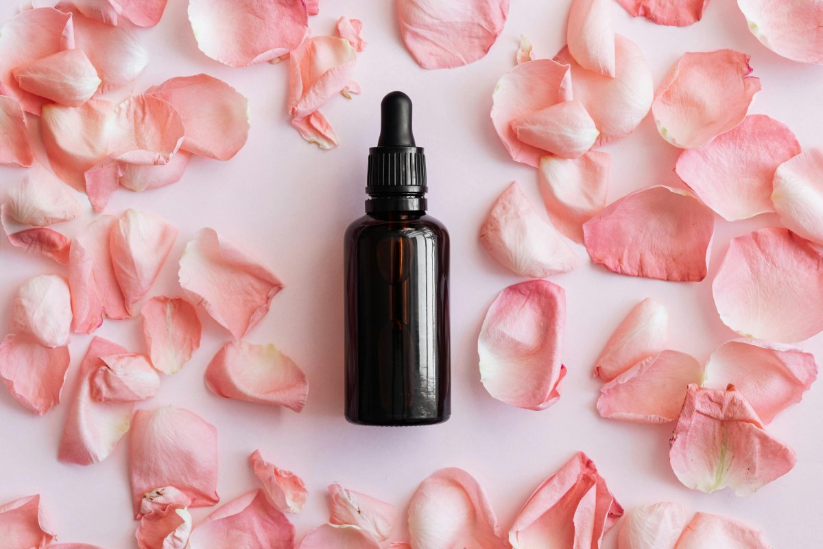 set-of-pink-petals-and-bottle-on-table-stockpack-pexels.jpg Set of pink petals and bottle on table