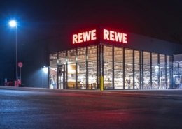 a retail store at night with the lights on