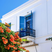 balcony-of-a-white-seaside-villa-with-blue-shutters-stockpack-pexels.jpg Balcony of a white seaside villa with blue shutters
