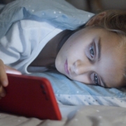 A girl watching on her smartphone