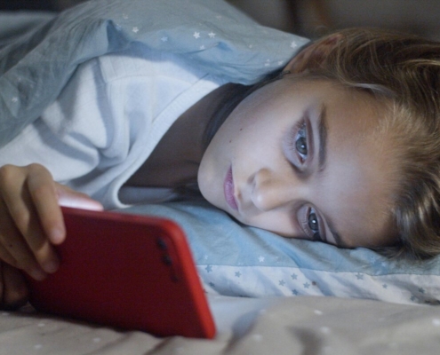 A girl watching on her smartphone