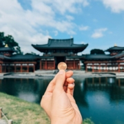 a-hand-holding-a-small-piece-of-food-in-front-of-a-body-of-water-stockpack-unsplash.jpg A hand holding a small piece of food in front of a body of water