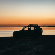 black-suv-on-beach-during-sunset-stockpack-unsplash.jpg black suv on beach during sunset