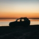 black-suv-on-beach-during-sunset-stockpack-unsplash.jpg black suv on beach during sunset